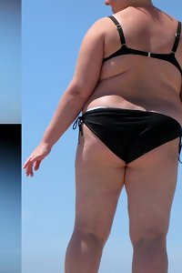 thick chick seductively poses with her curves