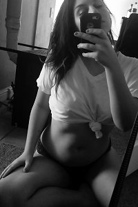 voluptuous woman seductively posing in lingerie