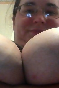 curvaceous plumper chick giving a seductive gaze while posing in undergarments